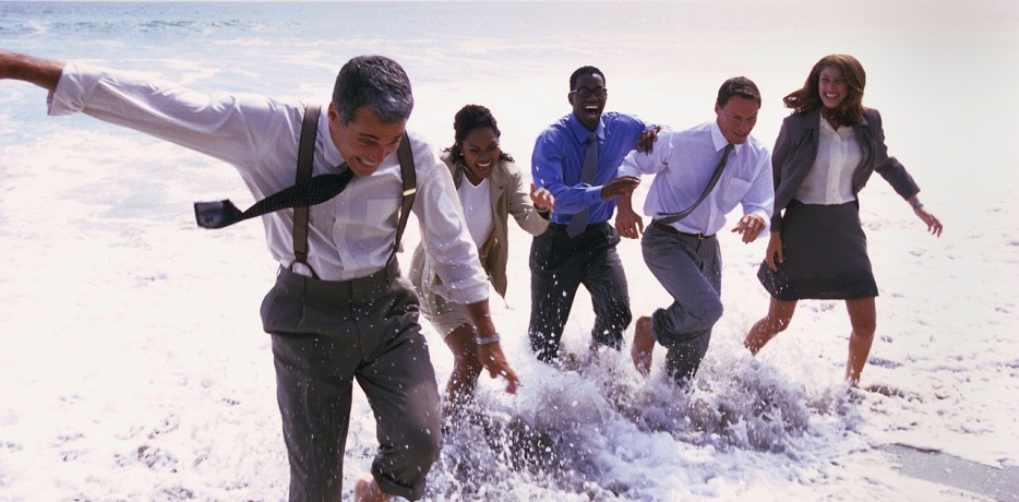 Businesspeople Playing in the Ocean